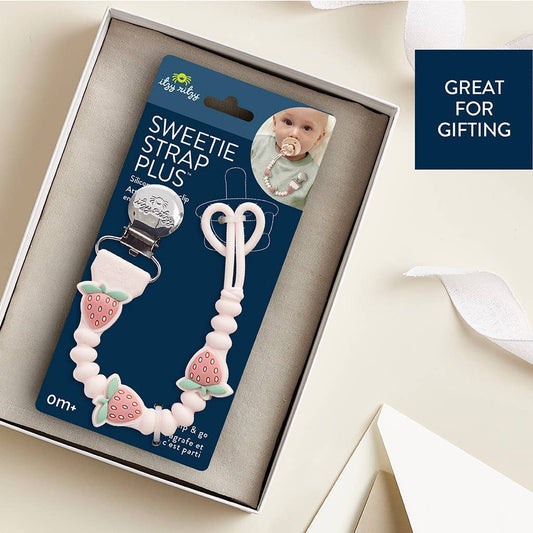 Baby pacifier clip with packaging labeled 'Sweetie Strap Plus' in a box on a light background.