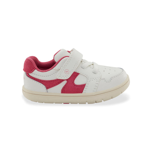 White and pink children's sneaker on a white background